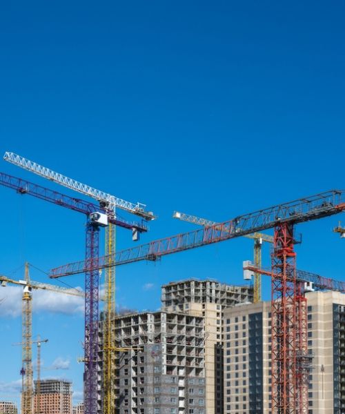 skyrise buildings with cranes